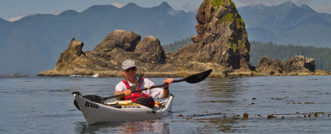 Sea Kayaker at Green Head, Bunsby Islands, BC