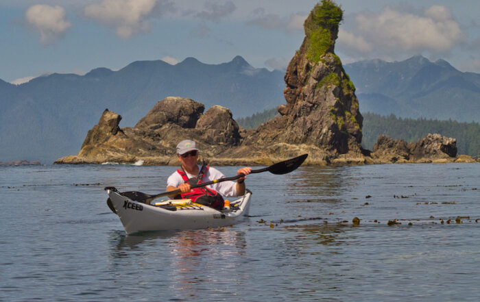 Sea Kayaker at Green Head, Bunsby Islands, BC